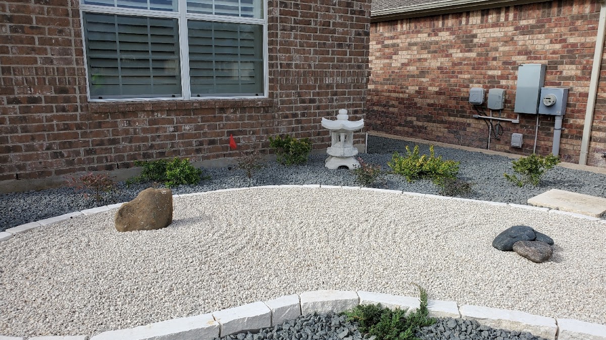 Front-yard zen garden with Japanese stone lantern and white gravel
